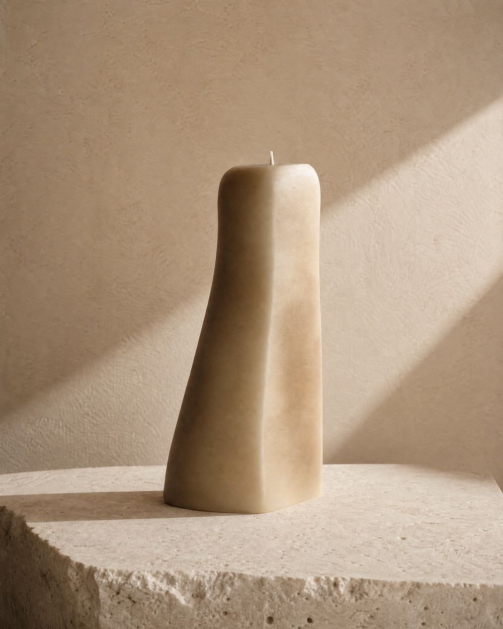 The Soft Form candle, a tall grounded silhouette in warm cream wax